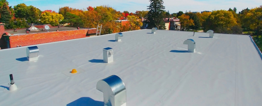 Elastomeric roofing membrane installed on commercial flat roof Ocean County NJ